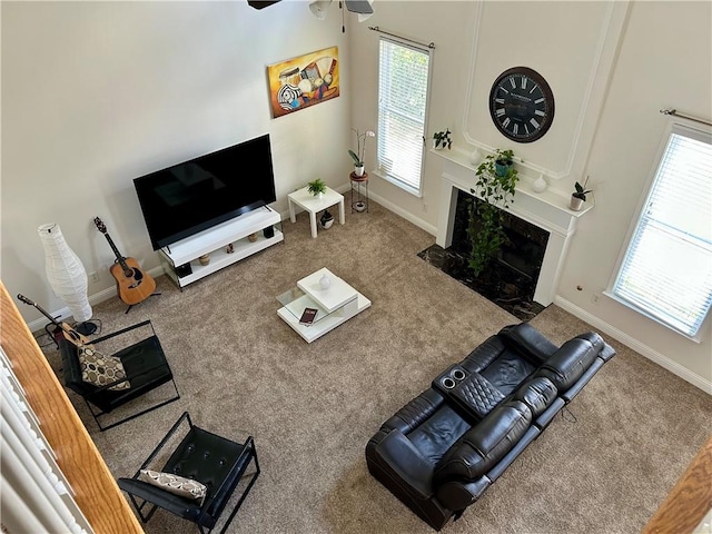1055 Havenstone Walk, Lawrenceville, GA 30045 - carpeted living area featuring a premium fireplace and a ceiling fan