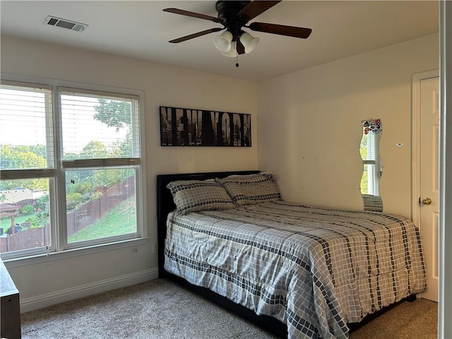 1055 Havenstone Walk, Lawrenceville, GA 30045 - carpeted bedroom featuring multiple windows and ceiling fan