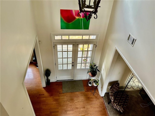 1055 Havenstone Walk, Lawrenceville, GA 30045 - entryway featuring a high ceiling, wood finished floors, and a chandelier