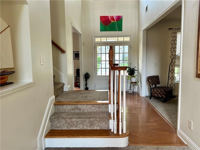 1055 Havenstone Walk, Lawrenceville, GA 30045 - entryway with wood finished floors, a towering ceiling, and stairway