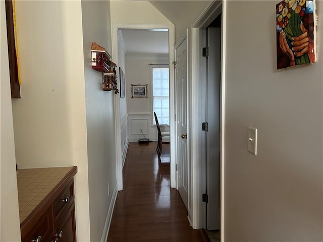 1055 Havenstone Walk, Lawrenceville, GA 30045 - corridor featuring dark wood finished floors and ornamental molding