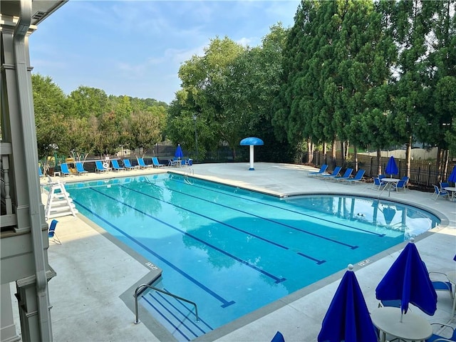 1055 Havenstone Walk, Lawrenceville, GA 30045 - community pool with a patio area and view of scattered trees