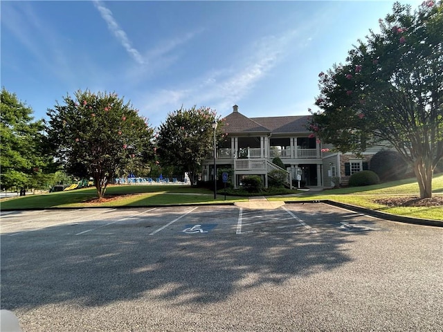 1055 Havenstone Walk, Lawrenceville, GA 30045 - view of front of home featuring uncovered parking, a front lawn, and stairway
