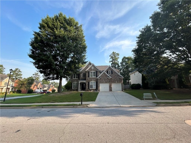 1055 Havenstone Walk, Lawrenceville, GA 30045 - traditional-style house with stone siding, concrete driveway, a front lawn, and a garage