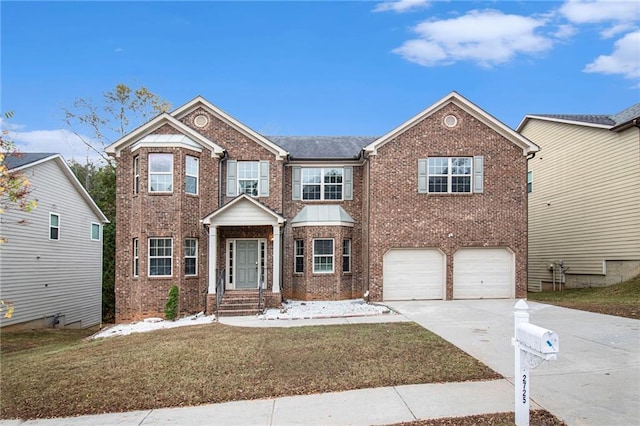 view of front of property with a front yard, an attached garage, brick siding, and driveway