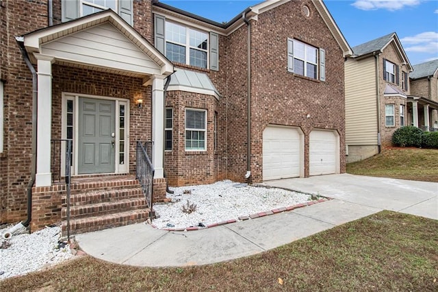 view of front of house with brick siding, concrete driveway, and an attached garage