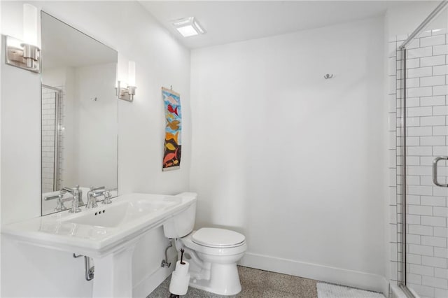 bathroom with toilet and walk in shower