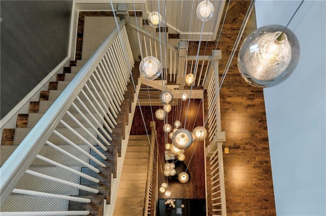201 Dovecrest Dr, Atlanta, GA 30305 - staircase featuring wood finished floors and a chandelier