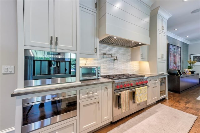 201 Dovecrest Dr, Atlanta, GA 30305 - kitchen featuring double oven range, wall chimney range hood, white cabinetry, decorative backsplash, and beverage cooler
