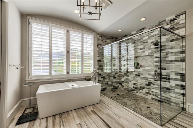 201 Dovecrest Dr, Atlanta, GA 30305 - full bathroom featuring a soaking tub, a stall shower, recessed lighting, a chandelier, and baseboards