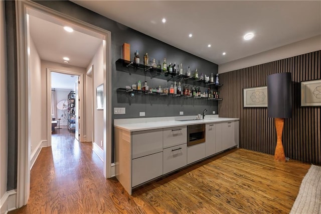 201 Dovecrest Dr, Atlanta, GA 30305 - indoor wet bar featuring wood finished floors, recessed lighting, baseboards, and an accent wall