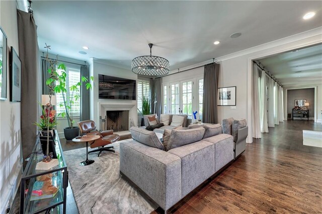 201 Dovecrest Dr, Atlanta, GA 30305 - living room with wood finished floors, recessed lighting, a fireplace with raised hearth, french doors, and ornamental molding