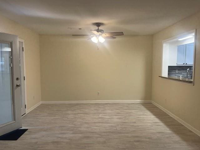 5950 Wintergreen Rd, Norcross, GA 30093 - empty room featuring wood finished floors, baseboards, and ceiling fan