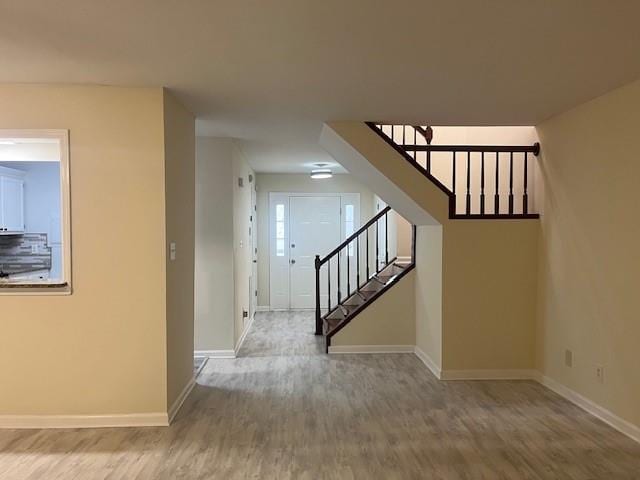5950 Wintergreen Rd, Norcross, GA 30093 - entrance foyer with stairway, baseboards, and wood finished floors
