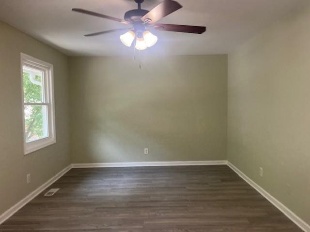 5950 Wintergreen Rd, Norcross, GA 30093 - spare room with a ceiling fan, dark wood-style flooring, and baseboards