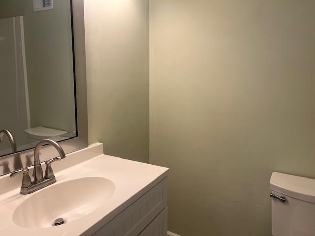 5950 Wintergreen Rd, Norcross, GA 30093 - bathroom with toilet and vanity