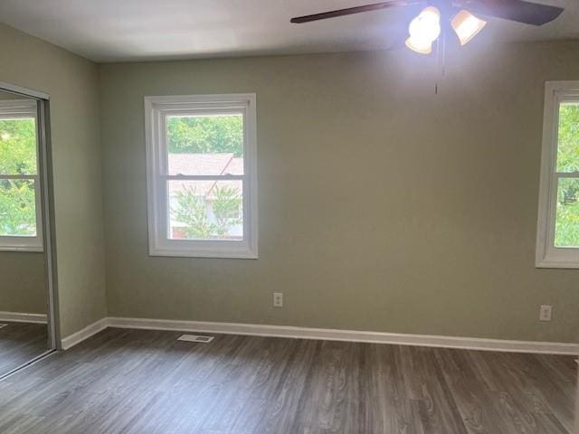 5950 Wintergreen Rd, Norcross, GA 30093 - unfurnished room with ceiling fan, dark wood-style floors, and baseboards