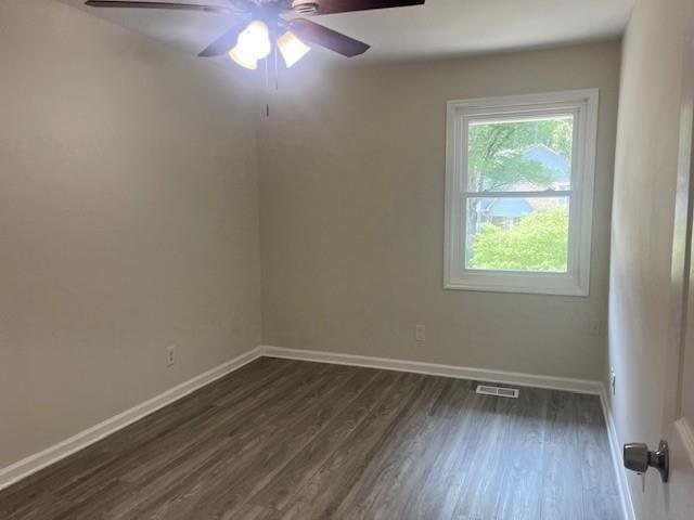 5950 Wintergreen Rd, Norcross, GA 30093 - spare room featuring a ceiling fan, dark wood-style floors, and baseboards