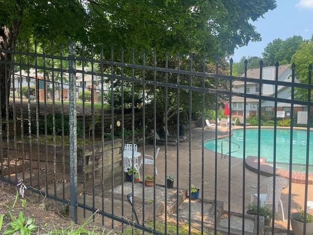 5950 Wintergreen Rd, Norcross, GA 30093 - gate featuring a community pool