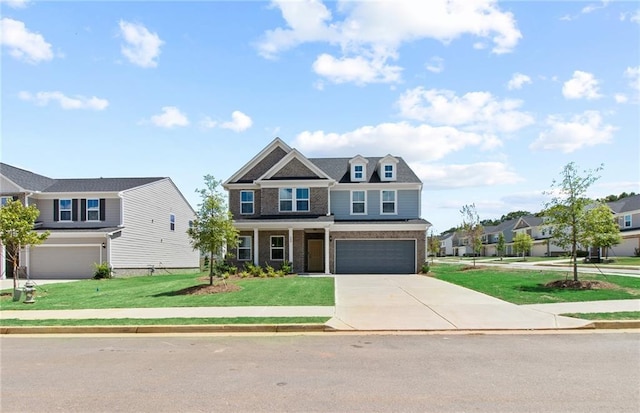 craftsman house featuring a garage and a front yard