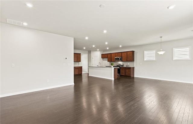 unfurnished living room with dark hardwood / wood-style floors and sink