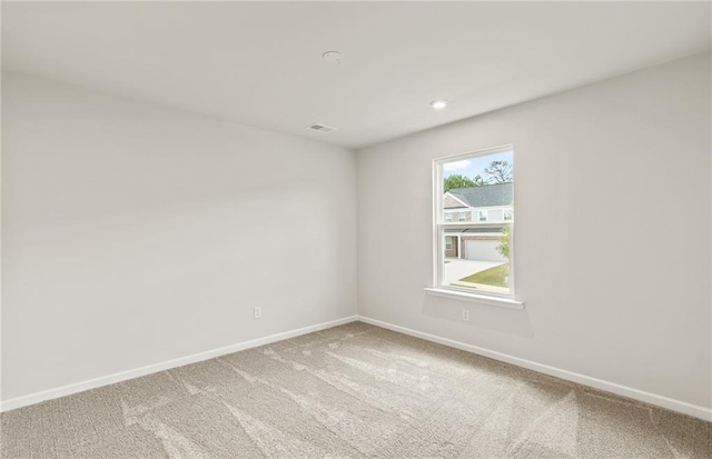 unfurnished room with carpet floors