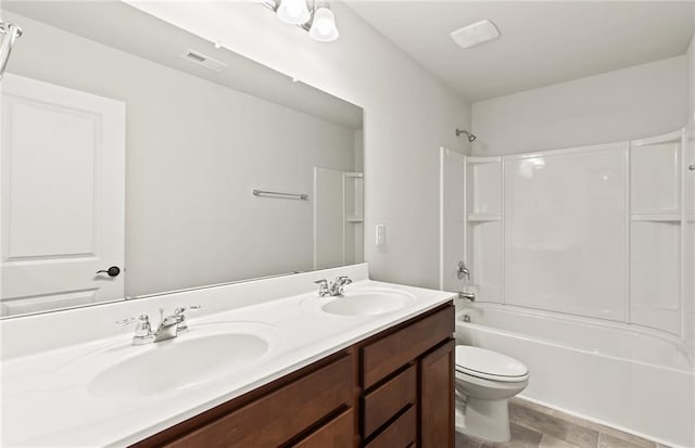 full bathroom featuring shower / tub combination, toilet, and vanity