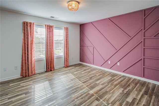 spare room with light hardwood / wood-style floors