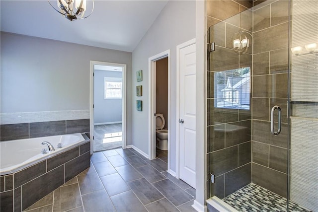 bathroom with lofted ceiling, toilet, tile patterned flooring, and plus walk in shower