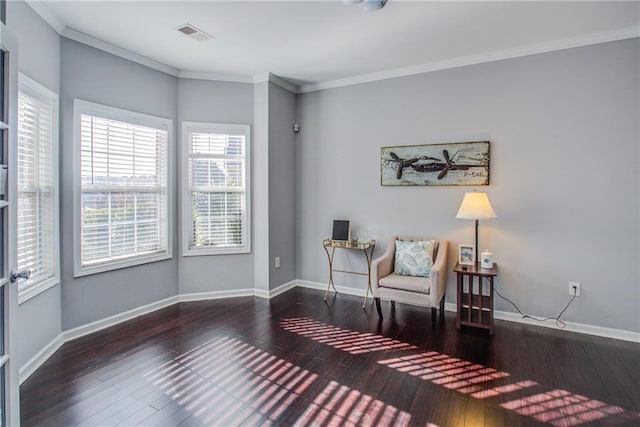 living area featuring dark wood-type flooring and crown molding