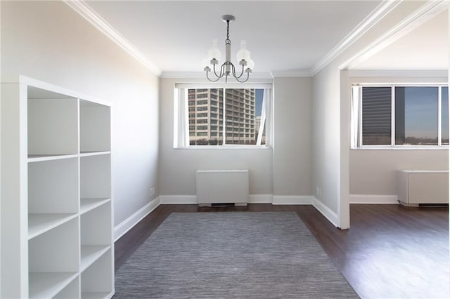 215 Piedmont Ave NE Unit 502, Atlanta, GA 30308 - unfurnished dining area with radiator, a chandelier, wood finished floors, and ornamental molding
