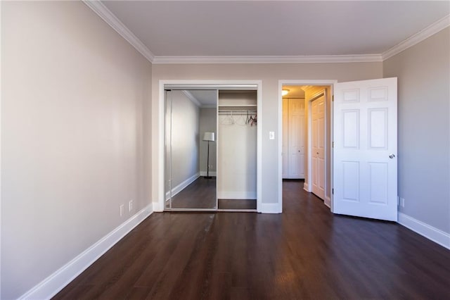 215 Piedmont Ave NE Unit 502, Atlanta, GA 30308 - unfurnished bedroom featuring dark wood-type flooring, crown molding, and a closet