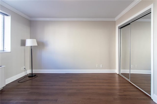 215 Piedmont Ave NE Unit 502, Atlanta, GA 30308 - unfurnished bedroom featuring ornamental molding, wood finished floors, and a closet