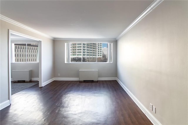 215 Piedmont Ave NE Unit 502, Atlanta, GA 30308 - empty room featuring radiator heating unit, dark wood finished floors, and ornamental molding