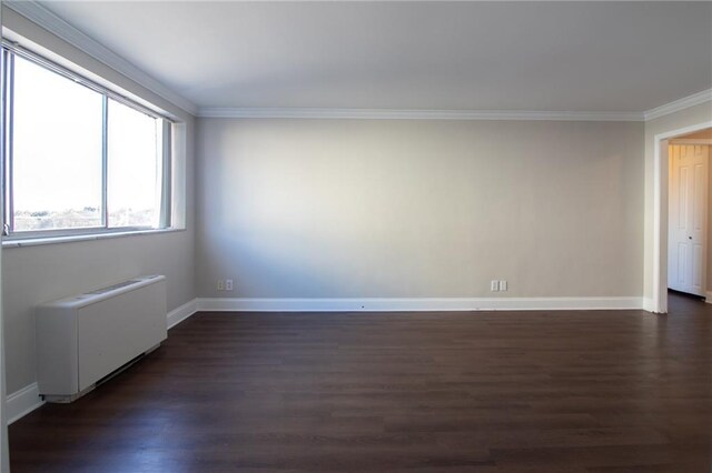 215 Piedmont Ave NE Unit 502, Atlanta, GA 30308 - empty room featuring radiator, ornamental molding, and dark wood-type flooring