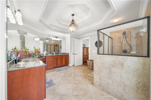 bathroom featuring tile patterned flooring, crown molding, an enclosed shower, a tray ceiling, and vanity