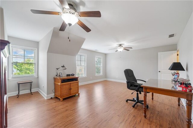 office with hardwood / wood-style flooring and ceiling fan