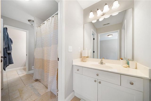 bathroom with tile patterned floors, vanity, and a shower with shower curtain