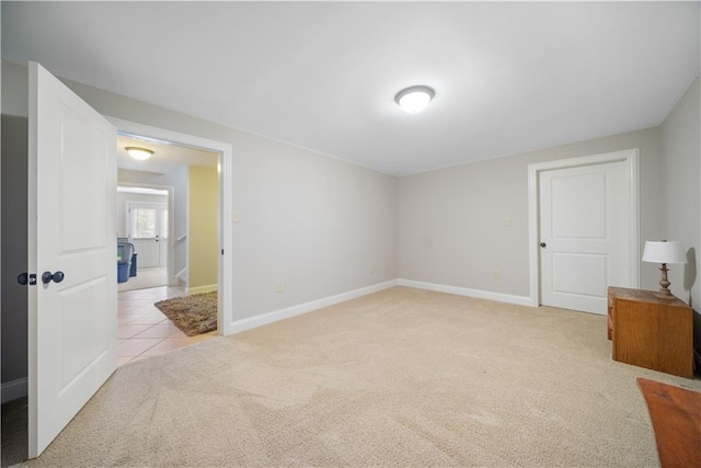 bedroom featuring light carpet