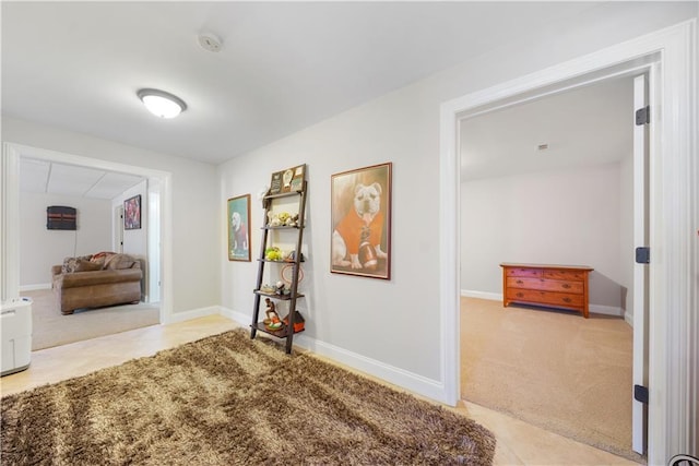 hallway featuring carpet