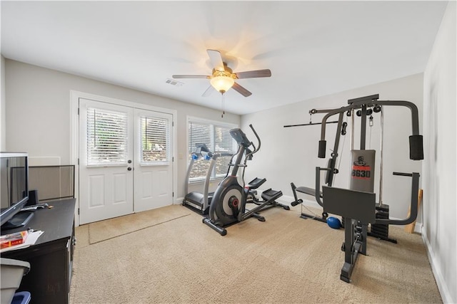 exercise room with carpet flooring and ceiling fan