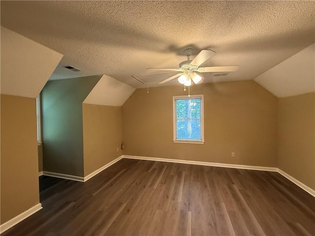 116 Cumberland Way, Dallas, GA 30132 - bonus room with a ceiling fan, wood finished floors, lofted ceiling, a textured ceiling, and attic access