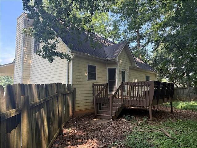 116 Cumberland Way, Dallas, GA 30132 - rear view of house with a wooden deck, roof with shingles, and a chimney