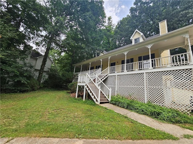 116 Cumberland Way, Dallas, GA 30132 - view of front of house featuring a porch, stairway, a front yard, and a chimney