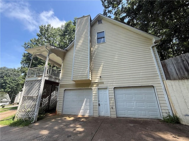 116 Cumberland Way, Dallas, GA 30132 - view of side of home with a garage, a chimney, and driveway