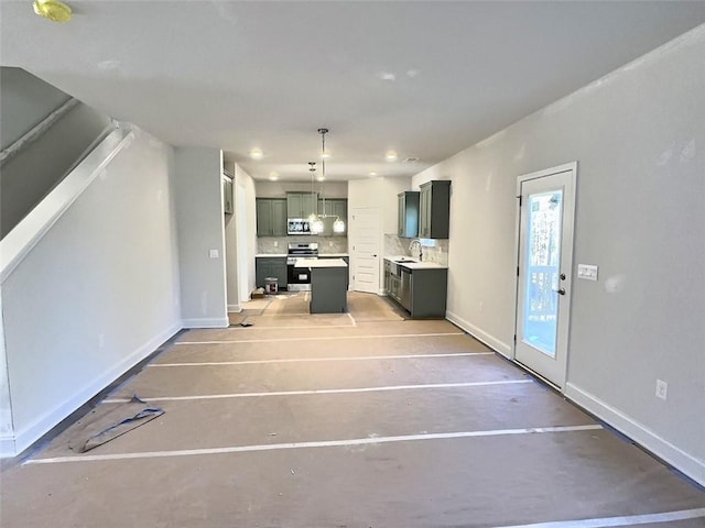 unfurnished living room featuring sink