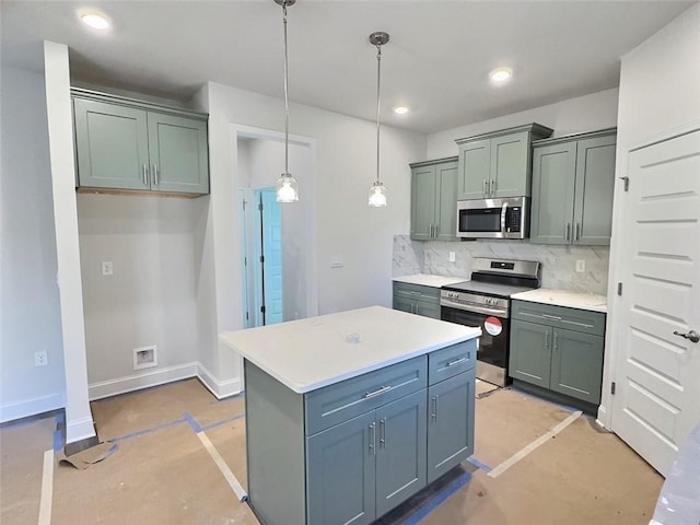 kitchen with pendant lighting, backsplash, stainless steel appliances, and a center island