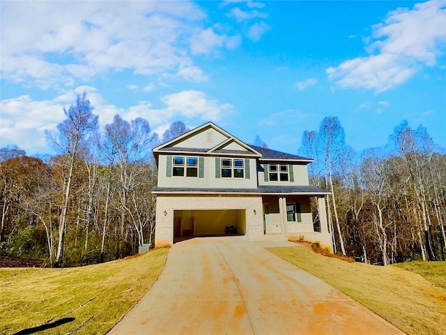 view of front of property with a garage and a front lawn