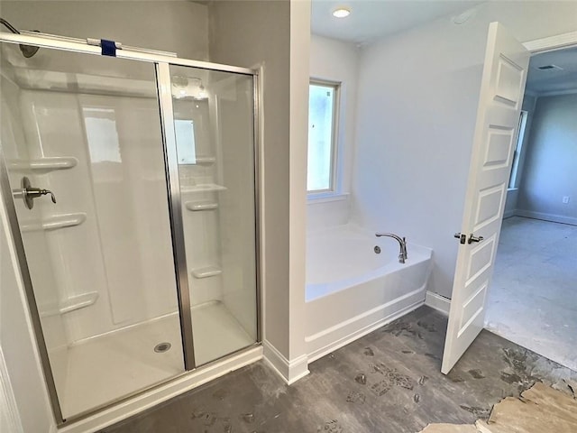 bathroom featuring wood-type flooring and shower with separate bathtub