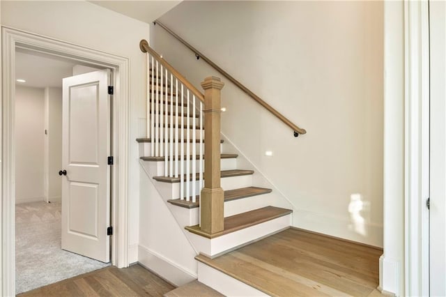 stairs with wood-type flooring